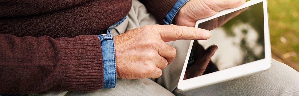 Elderly man using a tablet