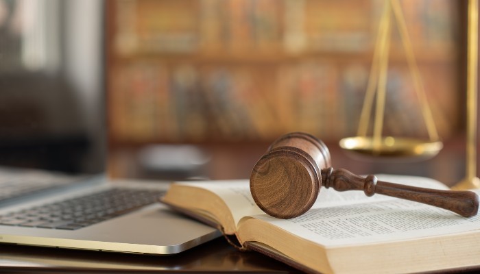 A gavel resting on a book 