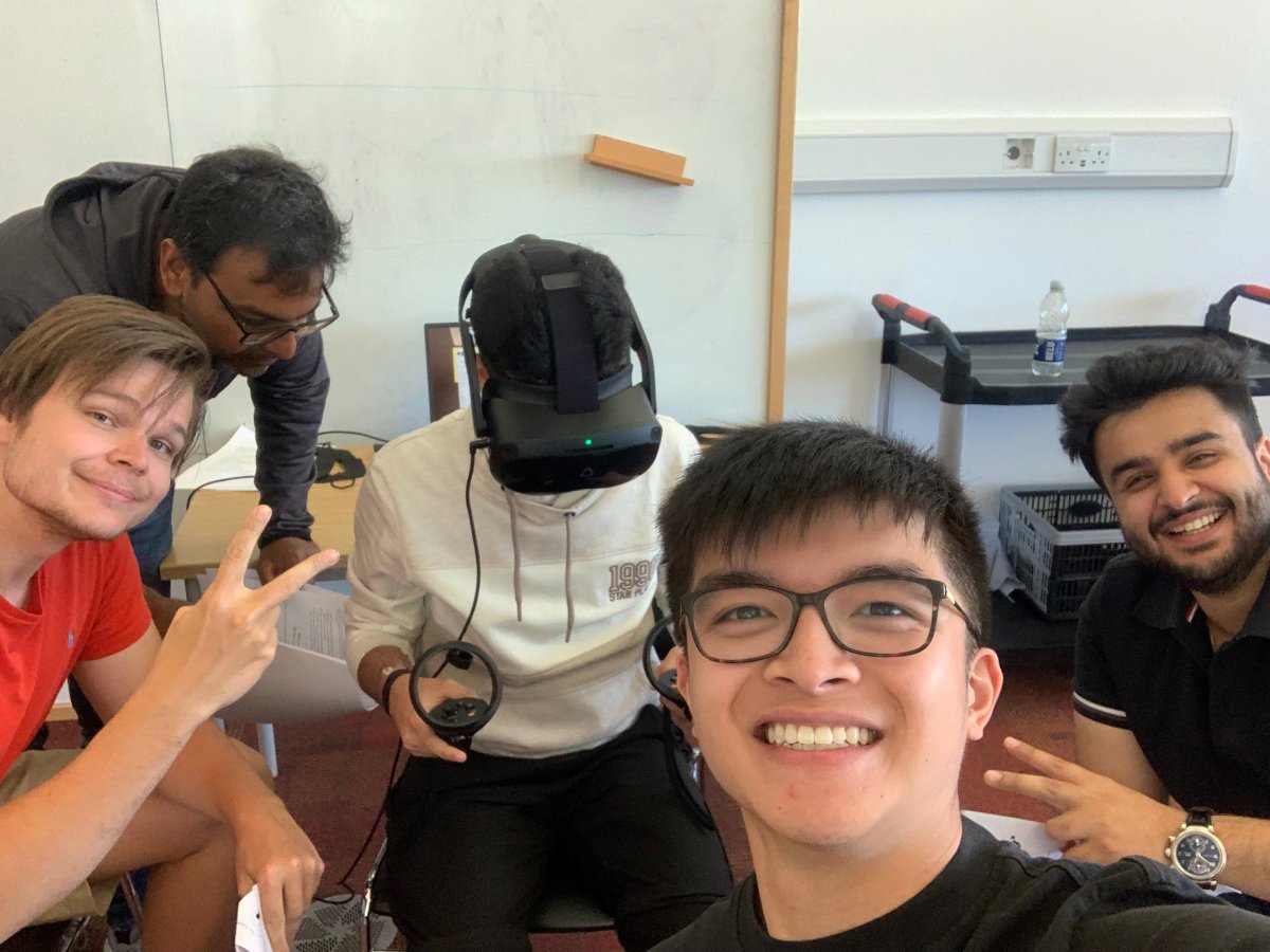 Management MSc student Dom Wong with fellow postgrads trying out virtual reality equipment