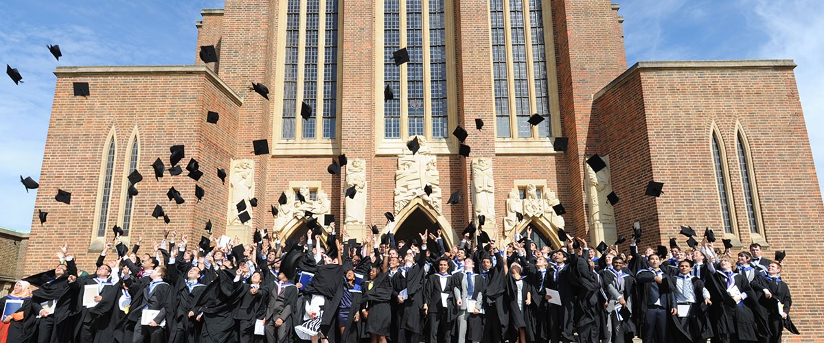 Graduates throwing caps in the air