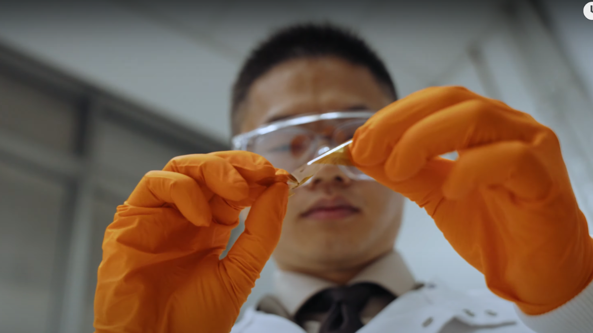 Dr Kai Wang examines semiconductor in a lab