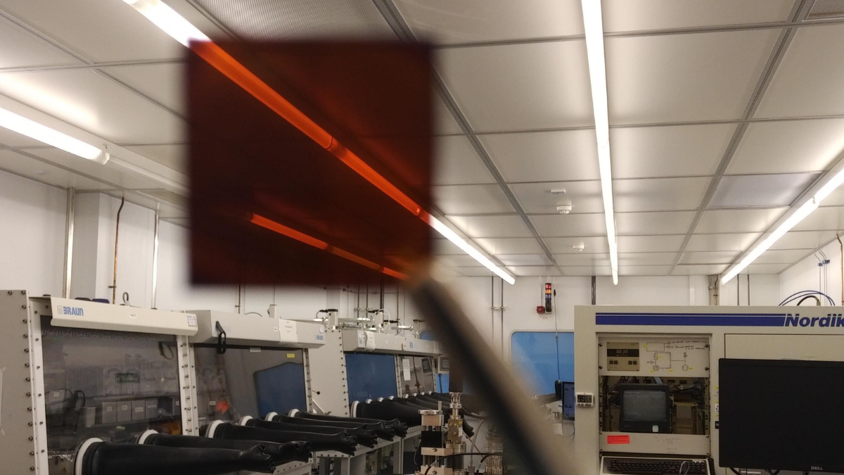 solar cell held up in lab