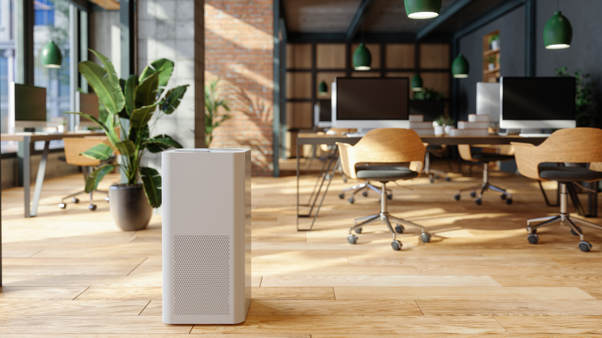 stock photo of a pleasant office environment with an air purifier in the foreground