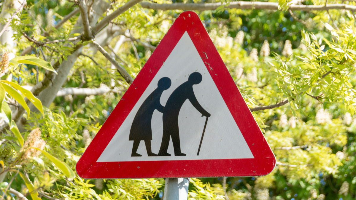 road sign warning that older people are crossing the road