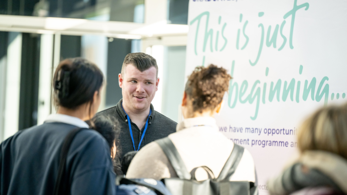 students talking to an employer at the vet careers event 