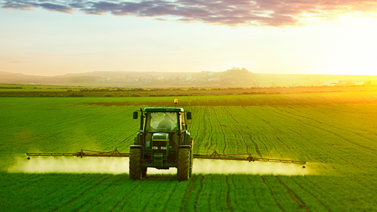 Tractor fertilising a field