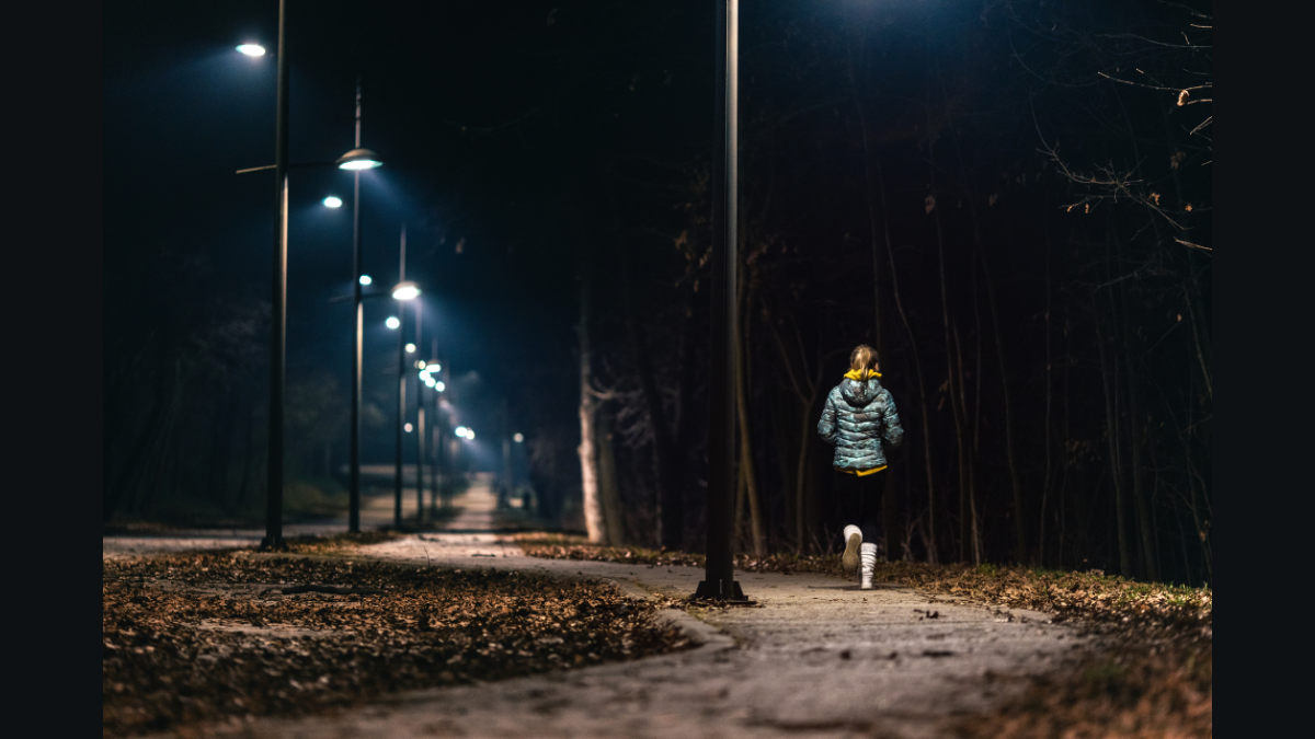 GettyImages - Woman running in a park at night