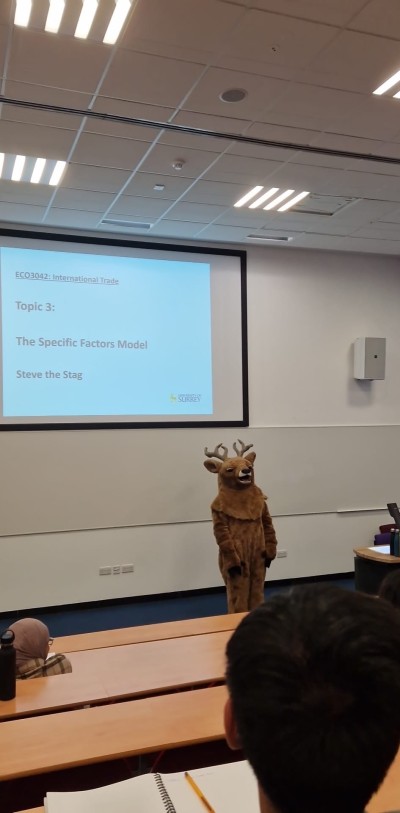 Dr Eric Golson lecturing as Surrey's mascot Steve the Stag