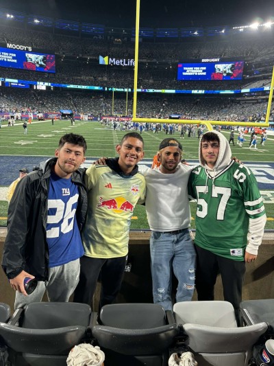 Yash, University of Surrey Economics student with friends at sports game in US