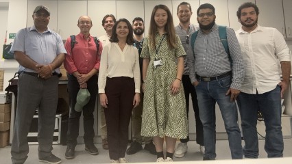 Participants of the event standing together, smiling