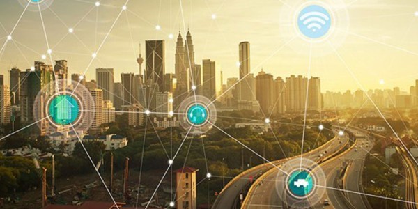 A city at sunrise with icons floating