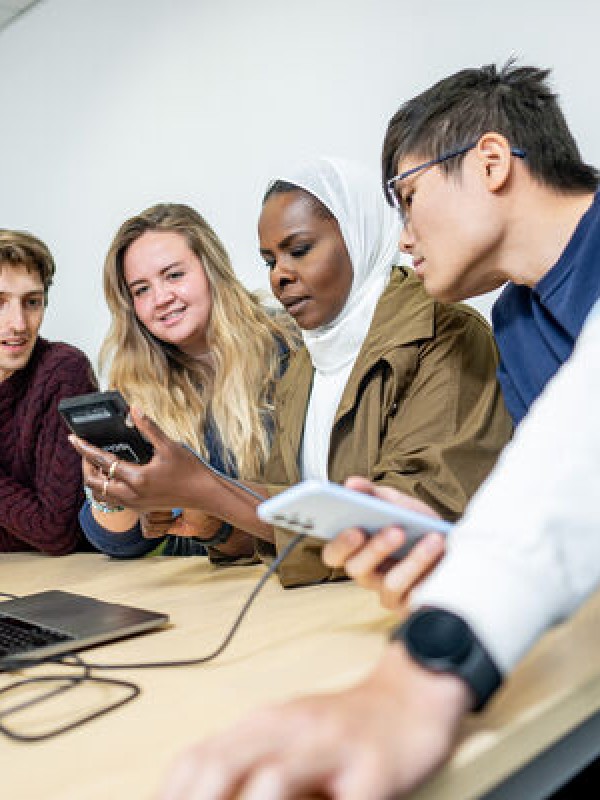 University of Surrey students looking at devices