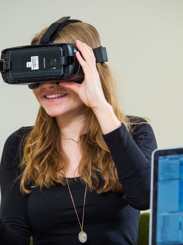 A female student in the School of Computer Science and Electronic Engineering uses a virtual reality headset