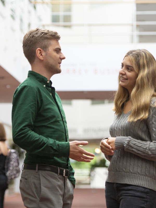 Students chatting as Surrey Business School