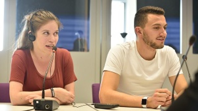 Two Surrey students engaged in a translation exercise