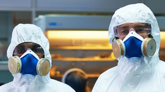 Two people in radiation masks