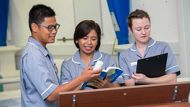 Three student nurses out in practice