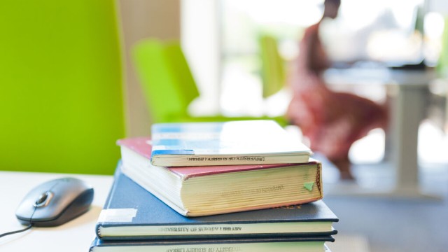 Books and mouse in library