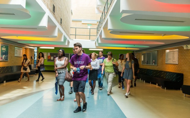 Student campus tour inside building