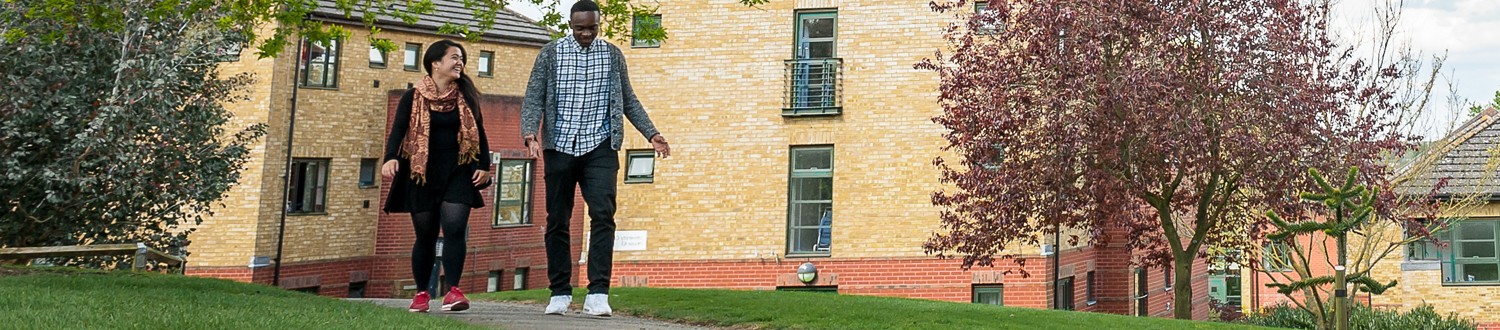 Students walking through accommodation