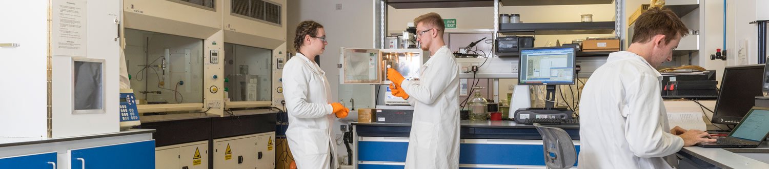 Physics students in a lab