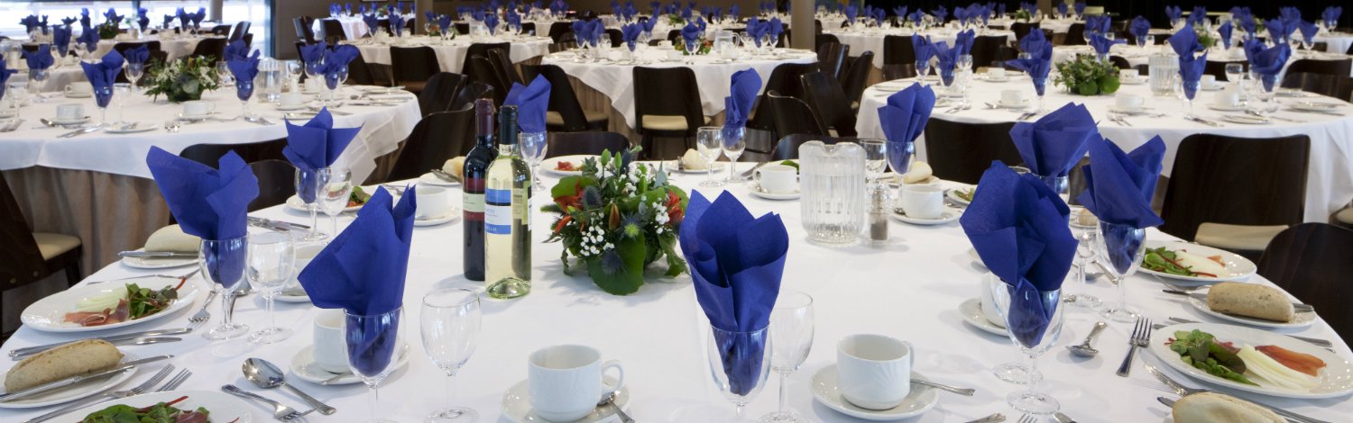 Tables laid out for conference event at Oak House