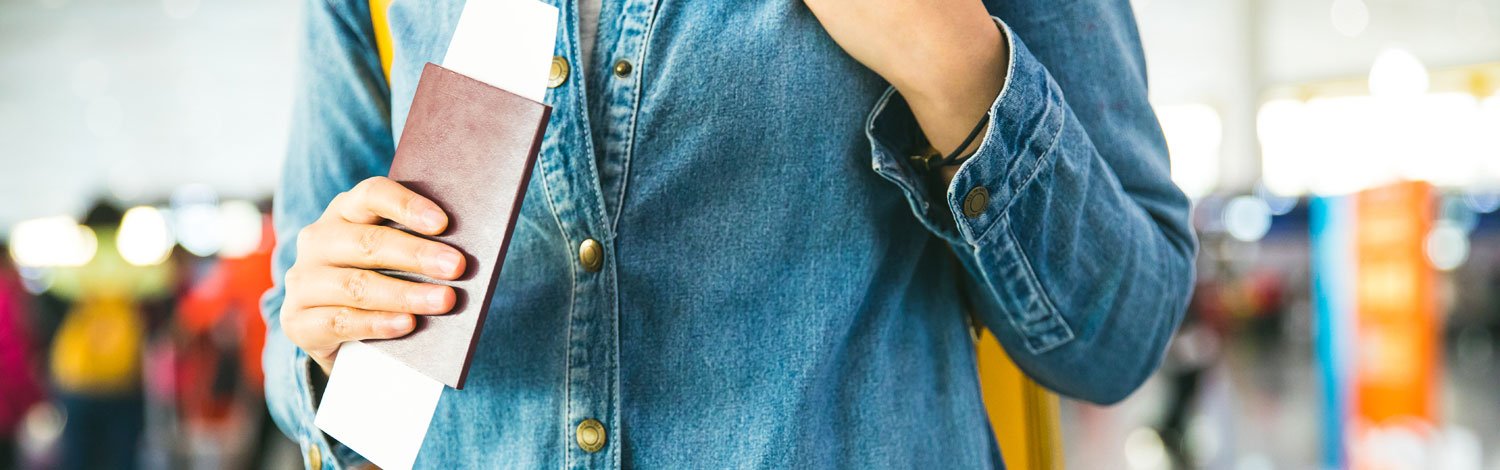 Person carrying passport at the airport