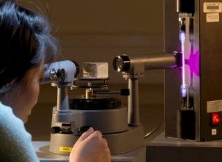 Female using physics equipment