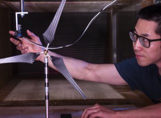 Student using equipment in a wind tunnel