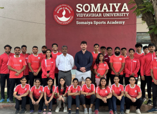 Group photo outside main entrance to the Somaiya Sports Academy, with Dr Nitin Khanvilkar and his sport science students.