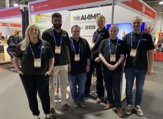 Members of the AI4ME team on their stand at IBC 2024