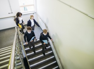 uk school children walk downstairs
