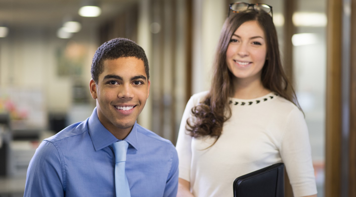 Two university students pictured in a modern office