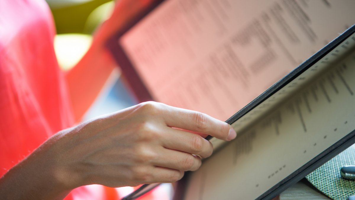 woman looking at menu