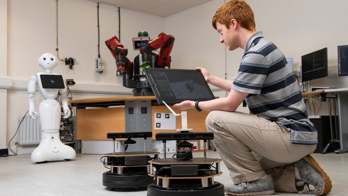 Electrical and electronic engineering student in robotics lab