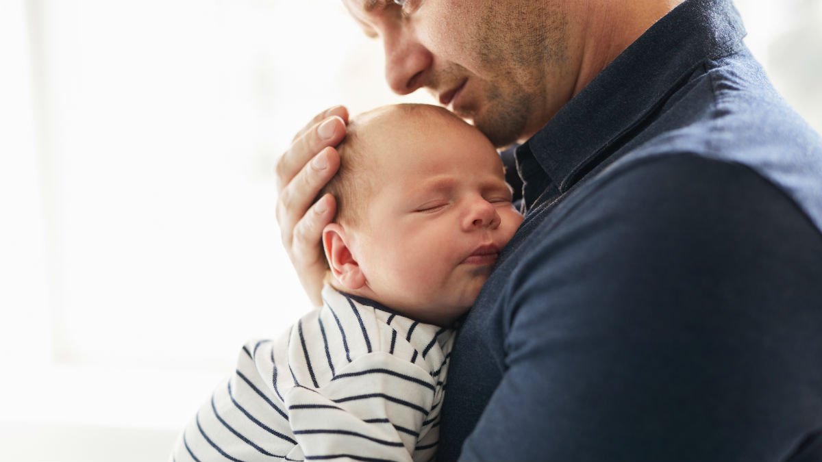 Father holding a baby