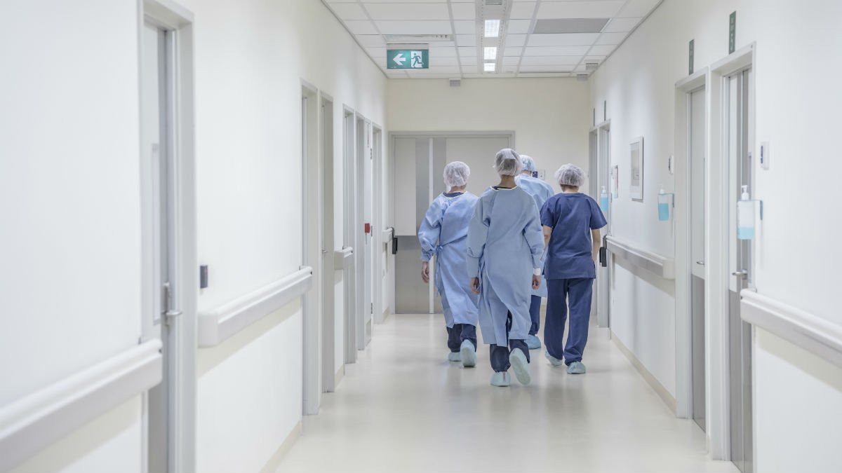 Surgeons walking down a hospital corridor