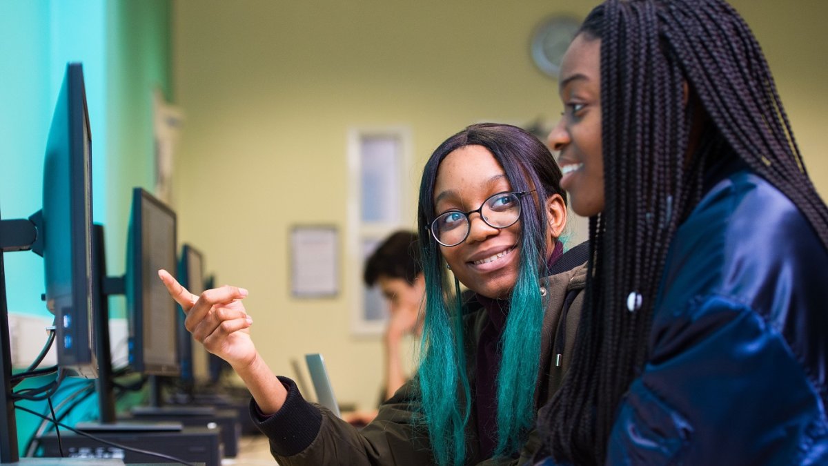 Two girls in computer lab