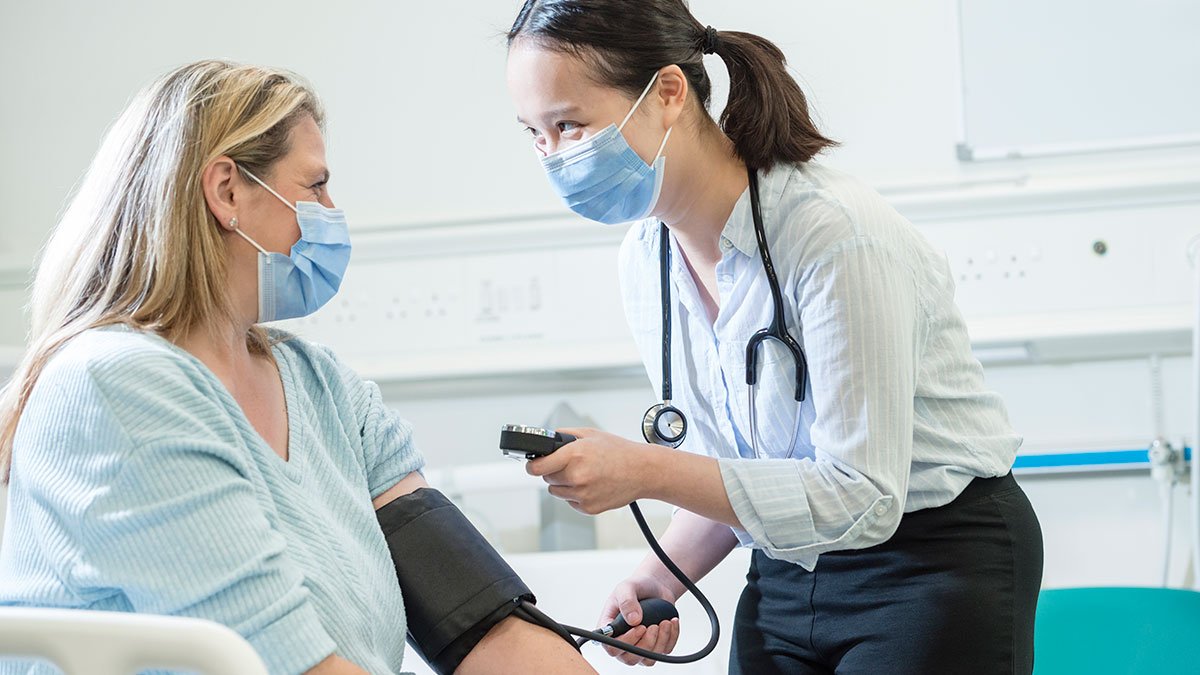 Student taking blood pressure