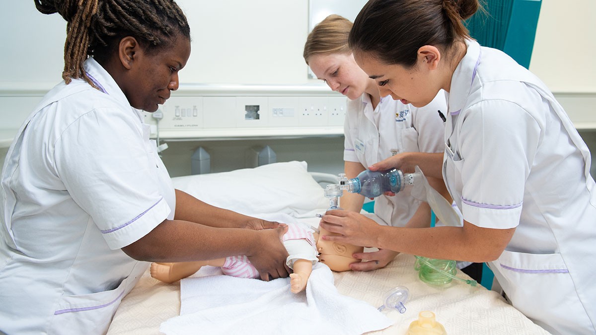 Nurses with doll