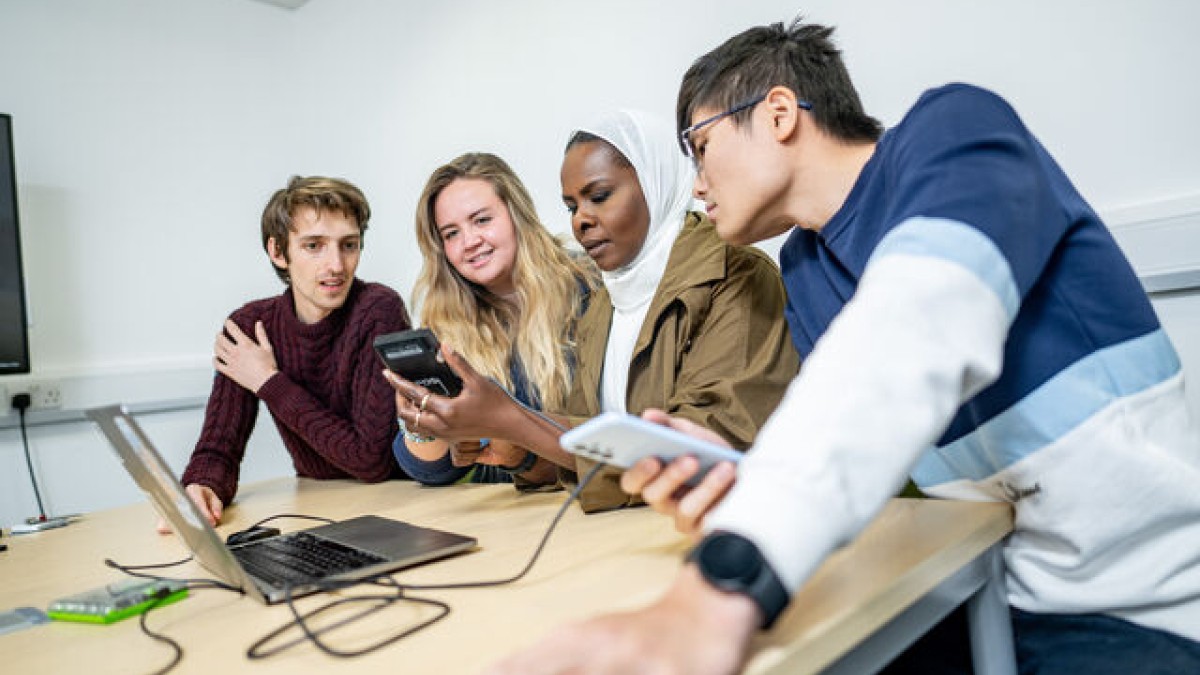 University of Surrey students looking at devices