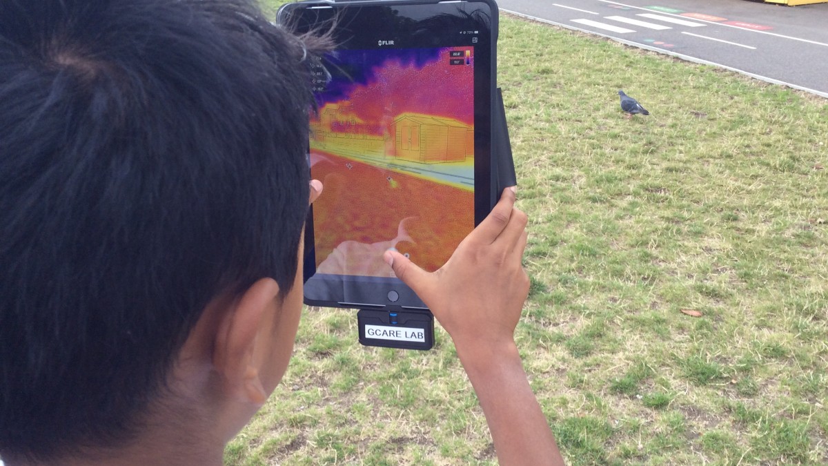 Children using a tablet to learn about air quality