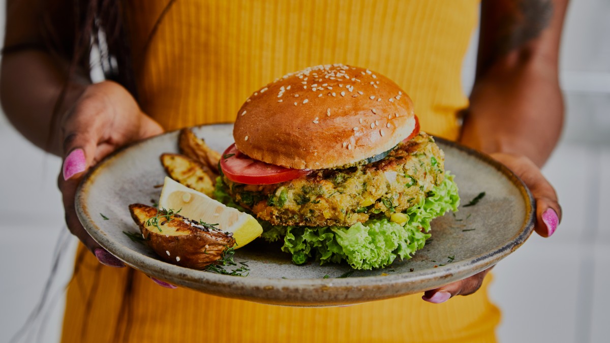 Person holds vegetarian burger